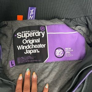 Large grey and purple outlined super dry jacket